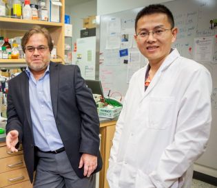 two men posing for a photo